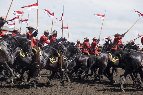 ZACHARY PRONG / WINNIPEG FREE PRESS  The RCMP Musical Ride performs a charge at the Morris Stampede on July 23, 2016.