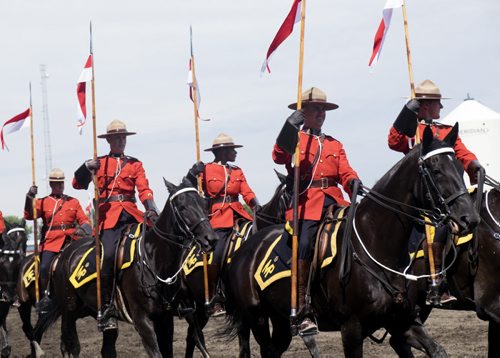 ZACHARY PRONG / WINNIPEG FREE PRESS  Const. Janis Kelly, third from right, performs with the RCMP Musical Ride at the Morris Stampede on July 23, 2016. Kelly, a Winnipeg native, is touring with the Musical Ride for the first time after a year of training.