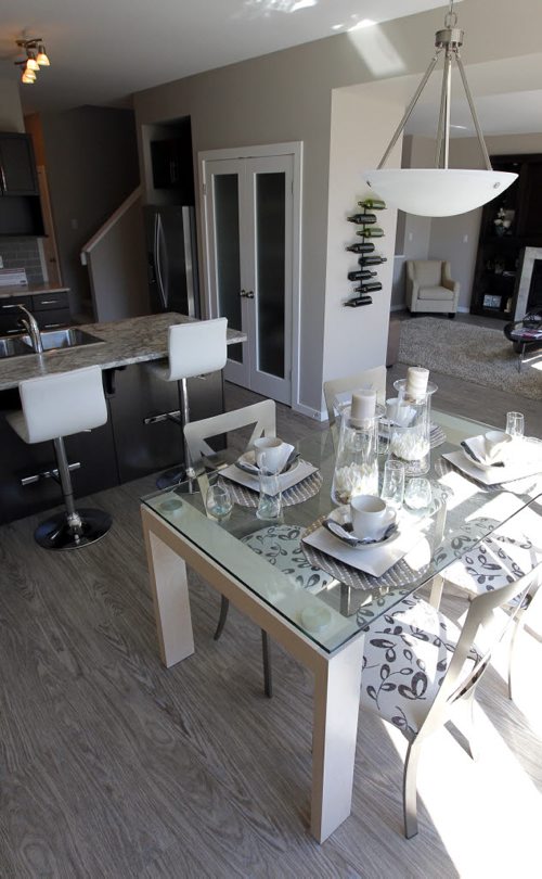 BORIS MINKEVICH / WINNIPEG FREE PRESS HOMES - 59 John Pelland Road in Sage Creek. Contact is Kensington Homes  salesman Rene Giroux. View from the eating area looking at the kitchen, left, and the living room, right.  July 25, 2016