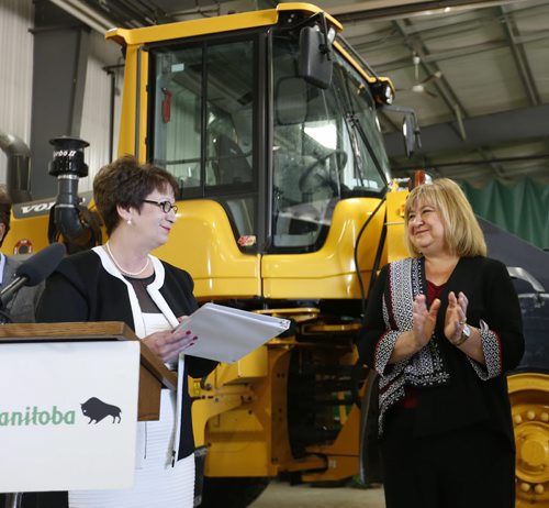 WAYNE GLOWACKI / WINNIPEG FREE PRESS       MaryAnn Mihychuk, Employment, Workforce Development and Labour Minister at right with Eileen Clarke,Indigenous and Municipal Relations Minister at a municipal infrastructure funding announcement for projects throughout the province. The announcement was held in the Public Works garage in the R.M. West St.Paul Monday  Larry Kusch story  July 25 2016