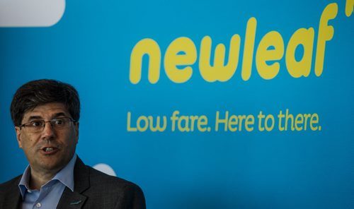 MIKE DEAL / WINNIPEG FREE PRESS Jim Young, CEO of Newleaf Travel Company speaks after the arrival of the first Newleaf flight from Hamilton, ON Monday morning. 160725 - Monday, July 25, 2016