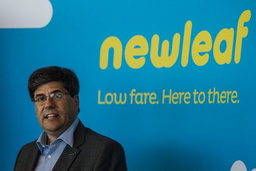 MIKE DEAL / WINNIPEG FREE PRESS Jim Young, CEO of Newleaf Travel Company speaks after the arrival of the first Newleaf flight from Hamilton, ON Monday morning. 160725 - Monday, July 25, 2016