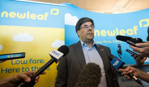 MIKE DEAL / WINNIPEG FREE PRESS Jim Young, CEO of Newleaf Travel Company talks to the media after the first plane for Newleaf Travel arrives at the Winnipeg Richardson International Airport Monday. 160725 - Monday, July 25, 2016