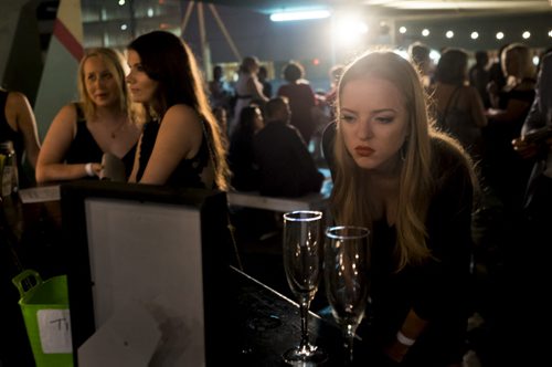 ZACHARY PRONG / WINNIPEG FREE PRESS  Jillayne Bohlen looks at the drink menu at the Royal Winnipeg Ballet's Barre After Hours rooftop party onJuly 23, 2016.