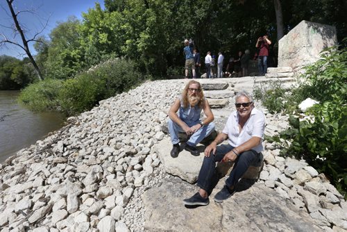 WAYNE GLOWACKI / WINNIPEG FREE PRESS    The newly constructed Annabella river access walkway to the Red River that runs off of the bicycle path near Curtis St. officially opened Tuesday.  Seated on the tyndall stone steps are artists and area residents Louis Bako, right, who designed the walkway and  Jordan Van Sewell who pitched the idea to politicians and eventually the Manitoba Gov't and the City of Winnipeg invested $60,700 in the project. The funding is a Building Communities Initiative funded by the province and the city to support community revitalization.   The walkway will give Point Douglas residents year round access to the river. see release.   July 26 2016