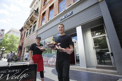 RUTH BONNEVILLE / WINNIPEG FREE PRESS   Business / De Pape story.   Peter Takis is a 21-year-old entrepreneur who owns three businesses in the Exchange one of which is The Epic Wedge Eatery which is an extension of  The List which just opened.    Photo of Peter Takis  and  Anna Guzzi outside newly opened eatery.    July 26, 2016