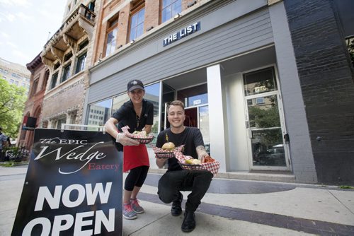 RUTH BONNEVILLE / WINNIPEG FREE PRESS   Business / De Pape story.   Peter Takis is a 21-year-old entrepreneur who owns three businesses in the Exchange one of which is The Epic Wedge Eatery which is an extension of  The List which just opened.     Photo of Peter Takis  and  Anna Guzzi outside newly opened eatery.    July 26, 2016