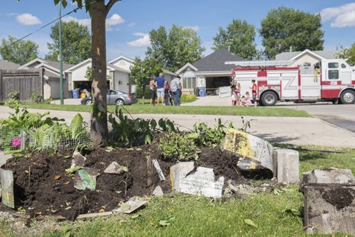 ZACHARY PRONG / WINNIPEG FREE PRESS  The SUV drove across several lawns before crashing into the home. July 26, 2016.