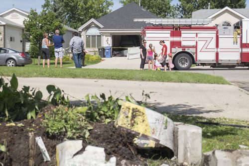 ZACHARY PRONG / WINNIPEG FREE PRESS  The SUV drove across several lawns before crashing into the home. July 26, 2016.