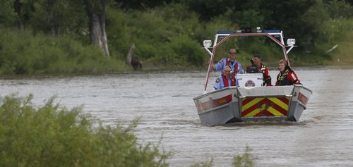 WAYNE GLOWACKI / WINNIPEG FREE PRESS    Winnipeg Fire water rescue members search the west shore of the Red River just north of the Harry Lazarenko Bridge after a report of a person in the water Wednesday afternoon.  July 27 2016