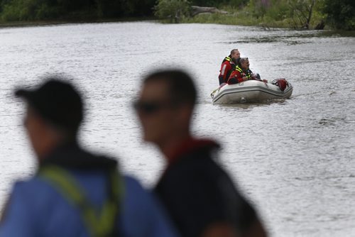 WAYNE GLOWACKI / WINNIPEG FREE PRESS    Winnipeg Fire water rescue members search the west shore of the Red River just south of the Harry Lazarenko Bridge after a report of a person in the water Wednesday afternoon.  July 27 2016