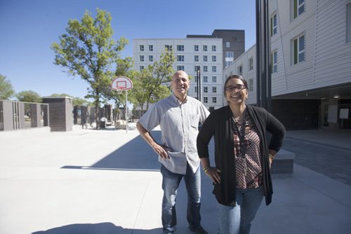 RUTH BONNEVILLE / WINNIPEG FREE PRESS  IRCOM 215 Isabel  Photo of Shereen Denetto - exec director of IRCOM  Immigrant and Refugee Community Organization of Manitoba  - and Site Director, Carlos Vialard in courtyard as they give FP a  sneak peak of the $14.7M (?)  MB Housing project Thursday.   The complex will house approx 60  newcomer families when it opens in September  The repurposed apartment blocks thats taken 3 years longer to finish than expected because of delays caused by legal battle between province and the developer.  See Carol Sanders  story  July 28, 2016