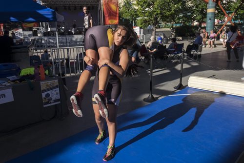 ZACHARY PRONG / WINNIPEG FREE PRESS  Jayden Ramgotra picks up her wrestling partner Jessica Rabet during a demonstration at The Forks. Athletes ran interactive kiosks demonstrating some of the sports that be presented at the Canada Summer Games. July 28, 2016.