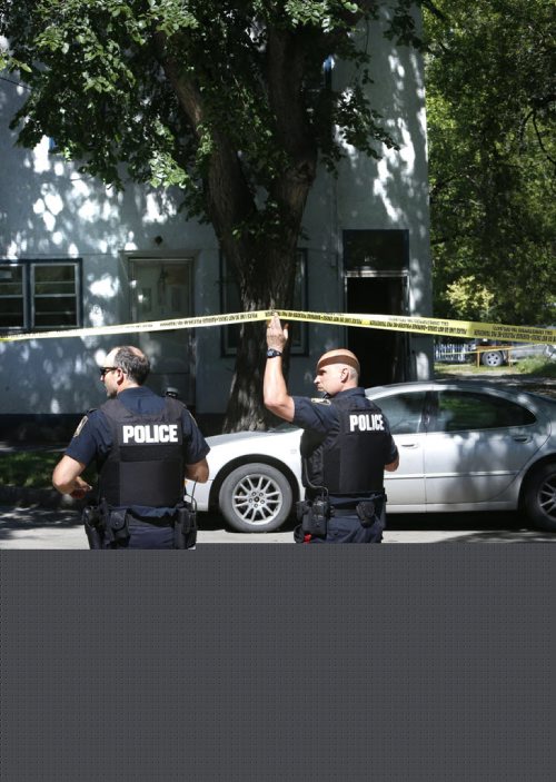 WAYNE GLOWACKI / WINNIPEG FREE PRESS Winnipeg Police at the aped off crime scene at a  multi-family residence in the 100 block of Bannerman Ave. Friday. July 29 2016