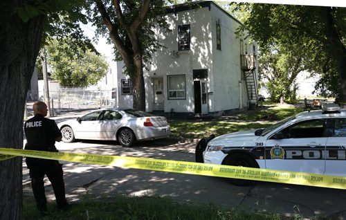 WAYNE GLOWACKI / WINNIPEG FREE PRESS Winnipeg Police at the taped off crime scene at a multi-family residence in the 100 block of Bannerman Ave. Friday.  July 29 2016