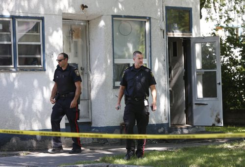 WAYNE GLOWACKI / WINNIPEG FREE PRESS Winnipeg Police at the taped off crime scene at a multi-family residence in the 100 block of Bannerman Ave. Friday.July 29 2016