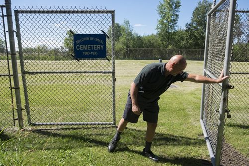 ZACHARY PRONG / WINNIPEG FREE PRESS  Bill Croydon, the Shaarey Zedek maintenance supervisor, opens the gates to the Children of Israel Cemetery. It is the oldest Jewish Cemetery in Canada. July 29, 2016.