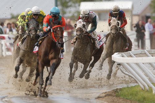 JOHN WOODS / WINNIPEG FREE PRESS Scott Stevens riding Inside Straight (3) enters the first corner in 5th place of the Manitoba Derby at Assiniboia Downs  Monday, August 1, 2016.