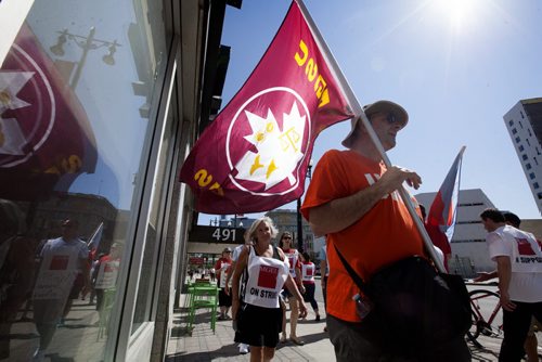 RUTH BONNEVILLE / WINNIPEG FREE PRESS  Employee's with the Macdonald youth service picket along the sidewalk in front of 491 Portage Ave. after going on strike at 10am Tuesday.   Aug 02, 2016  Aug 03, 2016