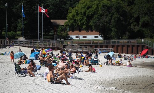 MIKE DEAL / WINNIPEG FREE PRESS  A modest crowd enjoys the sun, sand and water at Grand Beach the morning after two children drowned.   160802 Tuesday, August 02, 2016