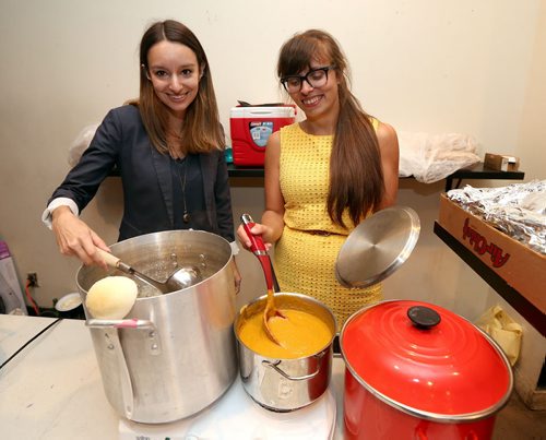 JASON HALSTEAD / WINNIPEG FREE PRESS  L-R: Organizers Melissa Hiebert and Tessa Vanderhart stire the soup at the first-ever Winnipeg SOUP crowdfunding event at the Handsome Daughter bar on July 19, 2016. (See Social Page)