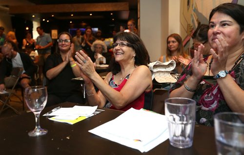 JASON HALSTEAD / WINNIPEG FREE PRESS  Attendees (including presenter Rose Marsden of the Indian and Métis Friendship Centre of Winnipeg, right) clap for a pitch at the first-ever Winnipeg SOUP crowdfunding event at the Handsome Daughter bar on July 19, 2016. (See Social Page)