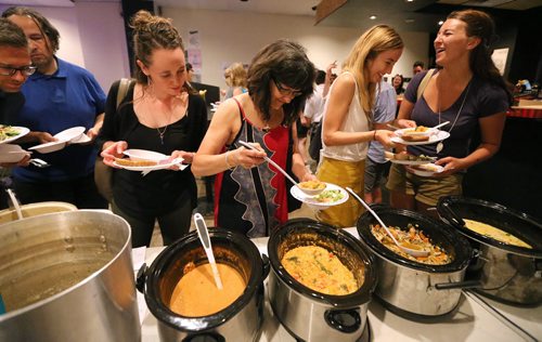 JASON HALSTEAD / WINNIPEG FREE PRESS  Attendees check out the soup selection at the first-ever Winnipeg SOUP crowdfunding event at the Handsome Daughter bar on July 19, 2016. (See Social Page)