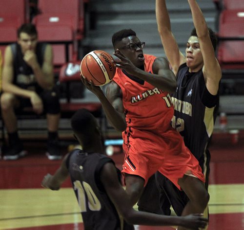 PHIL HOSSACK / WINNIPEG FREE PRESS -   Alberta's #11Sabry Philip (orange jersey) works his way around Manitoba's #12 Greg Wint in National Basketball 17 under action  at the Duckworth Centre Tuesday afternoon. August 2, 2016