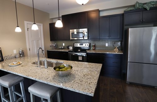 WAYNE GLOWACKI / WINNIPEG FREE PRESS    Homes. For a story on the second phase of The Woods condominiums at 89 Creek Bend Road. The kitchen in the display suite in The Woods phase one, phase 2 has not been built yet. The sales rep. is  David Powell.   Todd Lewys story  August 03 2016