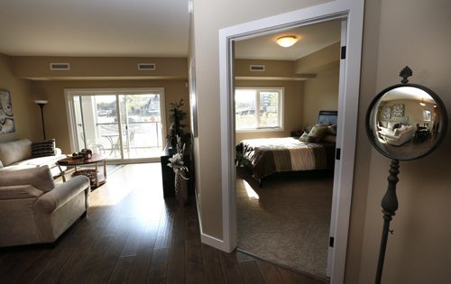 WAYNE GLOWACKI / WINNIPEG FREE PRESS    Homes. For a story on the second phase of The Woods condominiums at 89 Creek Bend Road. Living room and master bedroom at right in the display suite in The Woods phase one, phase 2 has not been built yet. The sales rep. is  David Powell.   Todd Lewys story  August 03 2016