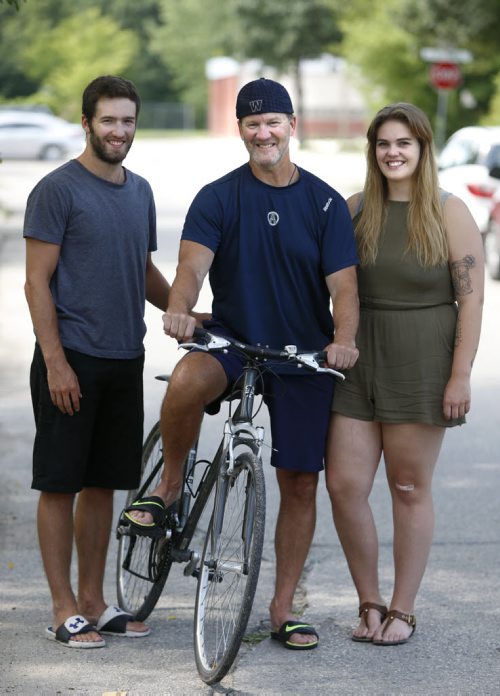 WAYNE GLOWACKI / WINNIPEG FREE PRESS  In centre, Mark Miles, 60, and his children Matt, 21, and Meghan, 19. Mark had a heart transplant on Sept. 25, 2015 and will be competing in the Canadian Transplant Games in 5 events: 20k and 5k cycle, 50m freestyle (swimming), 200m freestyle, 100m run. Ashley Prest story  August 03 2016