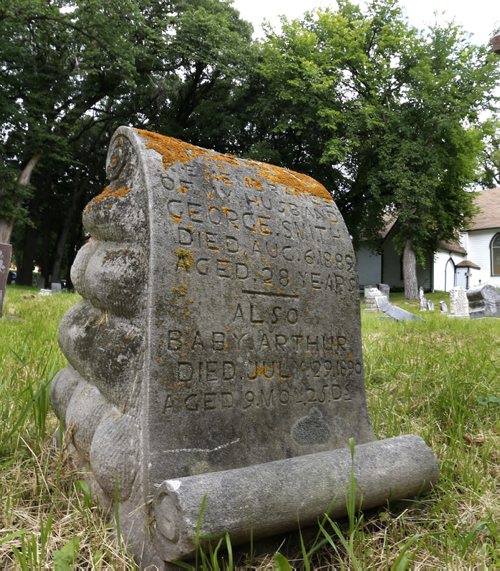 WAYNE GLOWACKI / WINNIPEG FREE PRESS       The Smith family grave stone in the  St. James Anglican Church cemetery across from Polo Park on Portage Avenue.    Kevin Rollason  story  August 03 2016