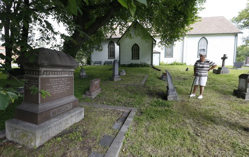 WAYNE GLOWACKI / WINNIPEG FREE PRESS  Margaret Steele gave the tour of the St. James Anglican Church cemetery across from Polo Park on Portage Avenue. At left, is the  grave of the prominent Wright family. Kevin Rollason  story  August 03 2016