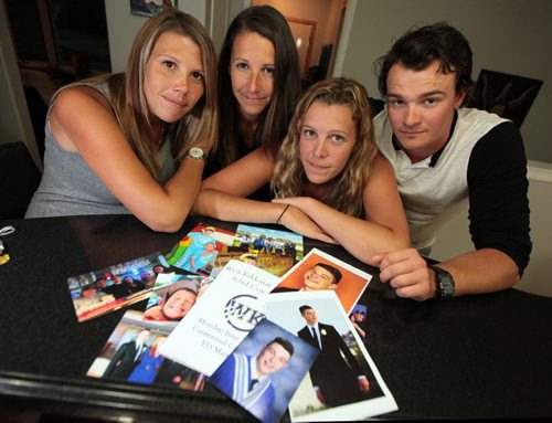 PHIL HOSSACK / WINNIPEG FREE PRESS -   Isaac Babinsky's siblings, Krista, Nicole, Mackenzie and Jake pose with a stack of family photos featuring Issac who died of an overdose just before his graduation. See Mike MacIntyre's story. August 3, 2016