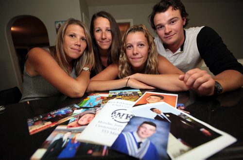 PHIL HOSSACK / WINNIPEG FREE PRESS -   Isaac Babinsky's siblings, Krista, Nicole, Mackenzie and Jake pose with a stack of family photos featuring Issac who died of an overdose just before his graduation. See Mike MacIntyre's story. August 3, 2016