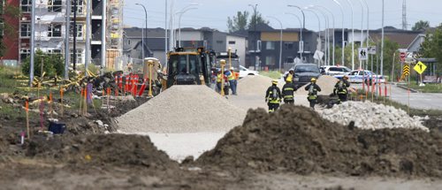 WAYNE GLOWACKI / WINNIPEG FREE PRESS     Winnipeg Fire Fighters and Police were at the scene on Keewatin St. near Paramount Rd. after road construction crews ripped open a 4 inch natural gas line. Nearby businesses and about 40 homes are evacuated.  August 04 2016