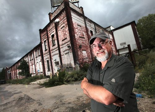 PHIL HOSSACK / WINNIPEG FREE PRESS -  U of M's Dr Gordon Goldsborough poses outside Vulcan Ironworks origional buiding on Maple street in Downtown Winnipeg.Abandoned now it was the site of one of the largest foundries on the prairies at one time. See story . August 4, 2016