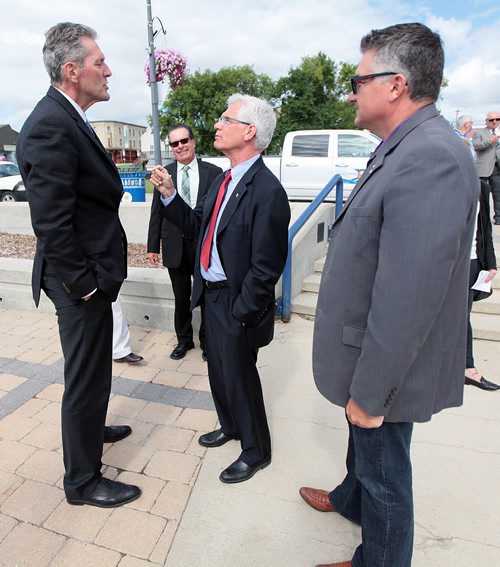 PHIL HOSSACK / WINNIPEG FREE PRESS -  Long and short of it.......Selkirk Mayor Larry Johannson (rear) and MP James Bezan (right) watche as Federal Minister Jim Carr and Premier Brian Pallister banter at the Selkirk waterfront while waiting to announce a joint program to improve water quality in the Lake Winnipeg Watershed. See Bill Redekop story. August 5, 2016