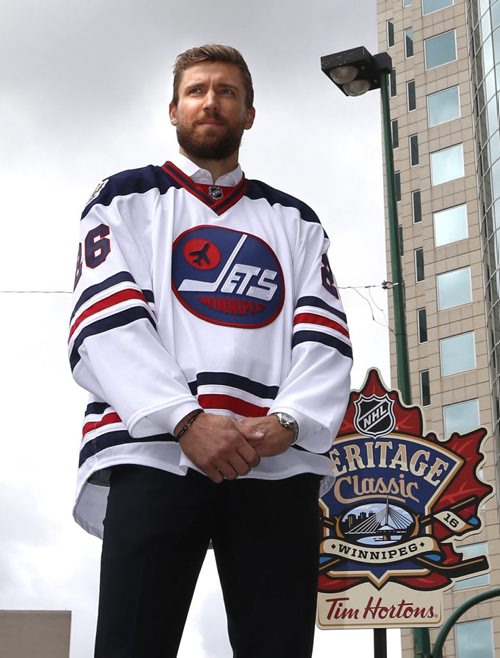 WAYNE GLOWACKI / WINNIPEG FREE PRESS   At the intersection of Portage and Main, Winnipeg Jets player Blake Wheeler wears the Heritage Classic jersey at the NHL event Friday. Heritage Classic jerseys for the Winnipeg Jets and Edmonton Oilers as well as lineups for the respective teams for the accompanying alumni game were unveiled in front of a frenzied audience of a couple hundred  Friday. Tim Campbell story August 5 2016