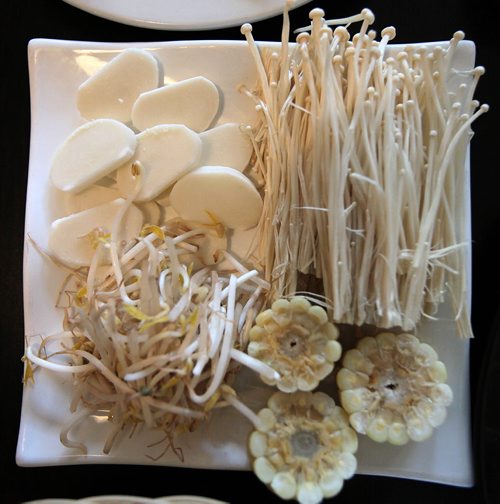 PHIL HOSSACK / WINNIPEG FREE PRESS - A platter of mushroom, bean sprout, corn and rice cake, waits to be added to the tabletop hotpot at the Asian Hot Pot. See Alison Gilmore's story.  August 5, 2016