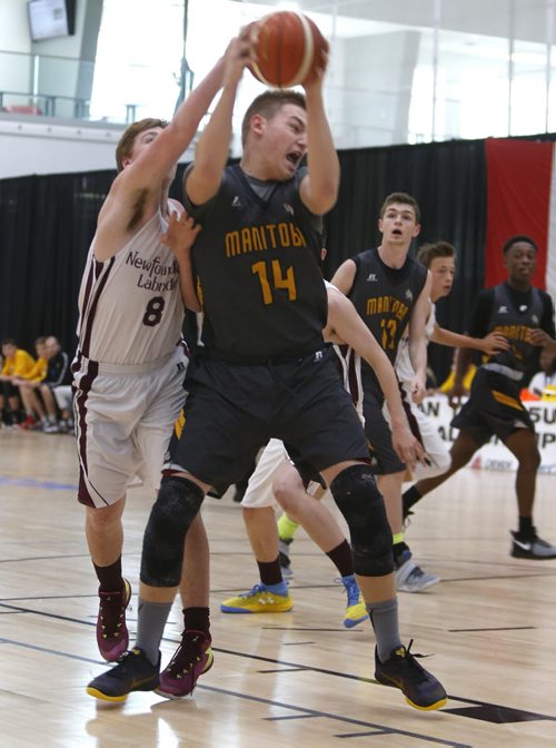 WAYNE GLOWACKI / WINNIPEG FREE PRESS     Manitoba forward Kyler Filewich fights for ball against Newfoundland and Labrador forward  #8 Carter Boland during a game in the National 15U basketball championships at the U of W.  Scott Billeck story August 5 2016