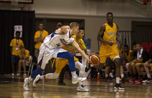 RUTH BONNEVILLE / WINNIPEG FREE PRESS  BC #14 Charles Bourque reaches to overtake ball from MB's #8 Matthew Medrano during the National Canada Basketball Championships at Duckworth Centre Saturday.    Aug 06, 2016
