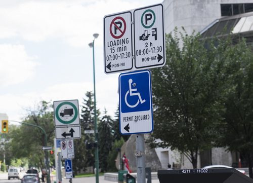 ZACHARY PRONG WINNIPEG FREE PRESS  Parking signs on Kennedy at a location identified by a a disgruntled Winnipeg Parking Authority ticket officer as being one of the most highly ticketed in the city. He says the signs are too confusing to motorists as it isn't clear if the loading zone, one of several similarly marked spots on the same street, is for handicapped drivers only. August 6, 2016.