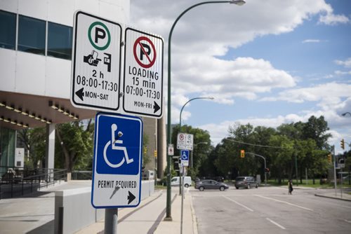ZACHARY PRONG WINNIPEG FREE PRESS  Parking signs on Kennedy at a location identified by a a disgruntled Winnipeg Parking Authority ticket officer as being one of the most highly ticketed in the city. He says the signs are too confusing to motorists as it isn't clear if the loading zone, one of several similarly marked spots on the same street, is for handicapped drivers only. August 6, 2016.