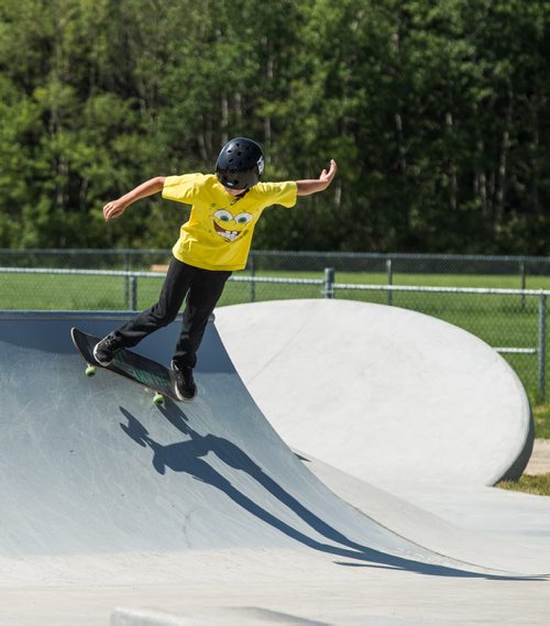 MIKE DEAL / WINNIPEG FREE PRESS The Justin Einarson Memorial Skatepark in Fort Richmond was dedicated by community members, officials from the City of Winnipeg and the Province Sunday afternoon.  Nolan Webster, 11, tries out some moves on the newly dedicated skatepark. 160807 - Sunday, August 07, 2016