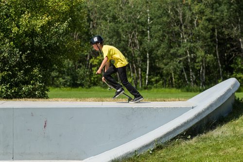 MIKE DEAL / WINNIPEG FREE PRESS The Justin Einarson Memorial Skatepark in Fort Richmond was dedicated by community members, officials from the City of Winnipeg and the Province Sunday afternoon.  Nolan Webster, 11, tries out some moves on the newly dedicated skatepark. 160807 - Sunday, August 07, 2016