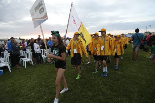 JOHN WOODS / WINNIPEG FREE PRESS Winnipeg Gold athletes enter the opening ceremonies of the Manitoba Games in Steinbach, Sunday, August 7, 2016.