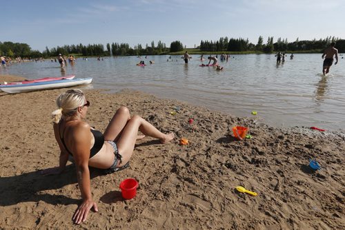 JOHN WOODS / WINNIPEG FREE PRESS Carmen Agoston keeps an eye on her kids at Birdshill Park, Sunday, August 7, 2016.