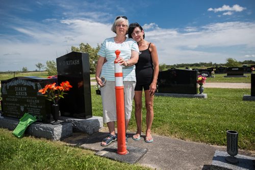MIKE DEAL / WINNIPEG FREE PRESS Sisters, June Feakes (left) and Brenda Winning Jensen at the plot site of their mother Nellie Yosyk who died in February and whose pre-paid tombstone is nowhere to be found. 160808 - Monday, August 08, 2016