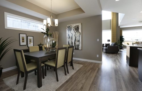 WAYNE GLOWACKI / WINNIPEG FREE PRESS    Homes. Dining area at left in the house at 48 East Plains Drive in Sage Creek. The  Qualico Homesrep. is  Courtney Sims.     Todd Lewys story August 8 2016